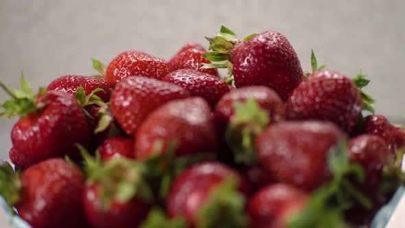 Check Out the Camera From a Full Basket of Fresh Strawberries in the Kitchen