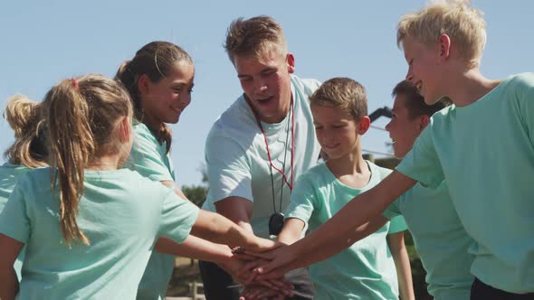 Group of Caucasian boys and girls at boot camp together