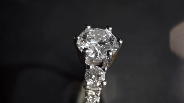 Extreme Detailed of Diamond Ring Close Up Shot While Rotating on Dark Background