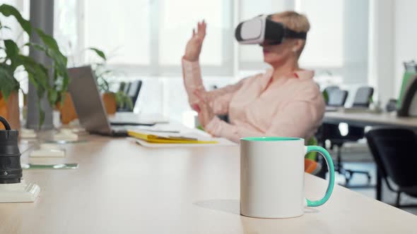 Female Entrepreneur Using 3d Virtual Reality Goggles at the Office