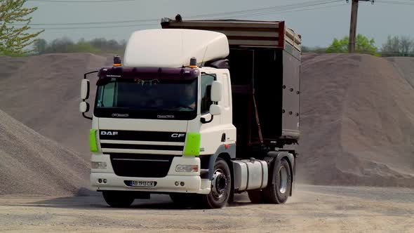 Transportation of crushed stone. Truck transports crushed stone in the storage