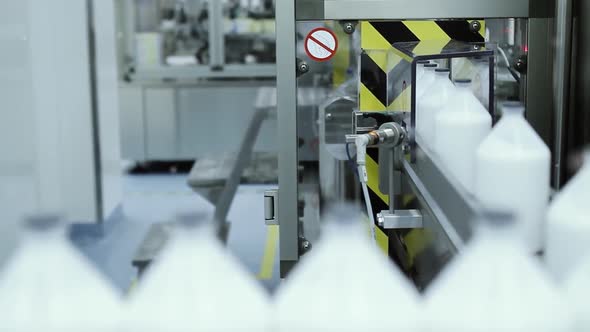 Vaccine Bottles for Animals being filled In Pharmaceutical Bottling Assembly Line Plant.