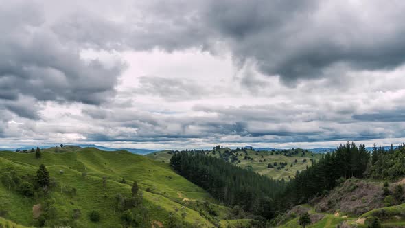 Grey Clouds Sky Move Fast over Green Country in New Zealand Mountains Nature
