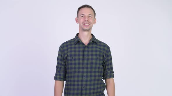 Studio Shot of Happy Hipster Man Smiling While Thinking