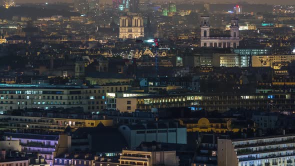 Aerial Panorama Above Houses Rooftops in a Paris Night Timelapse