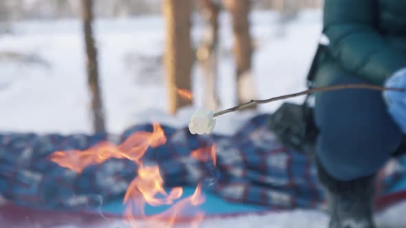 Fried Marshmallows on a Bonfire in Winter Hiking Trekking