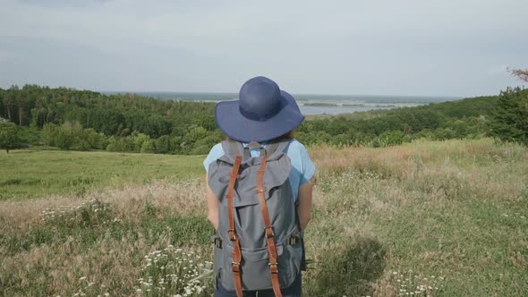 A Woman Travels with A Backpack in Beautiful Places