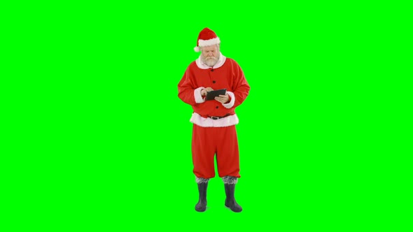 Santa claus using digital tablet