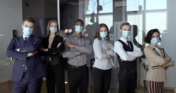 Motivated Multidimensional Business Team Stands Together in Conference Room, Confident Colleagues