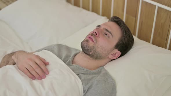 Upset Beard Young Man Thinking in Bed