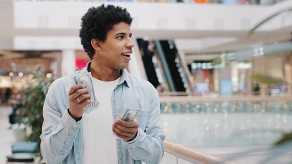 Happy African Successful Business Man Counting Money Standing Indoors