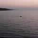 Drone flying around lonely boat at sunrise. - VideoHive Item for Sale