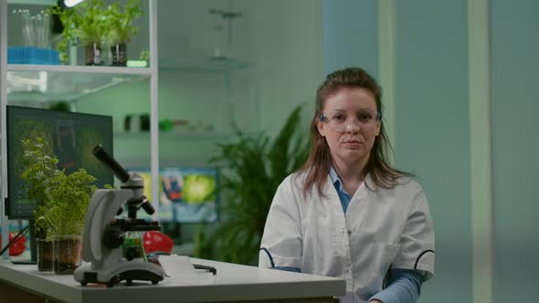 Pov of Botanist Woman in White Coat Listening Chemists Team During Online Videocall