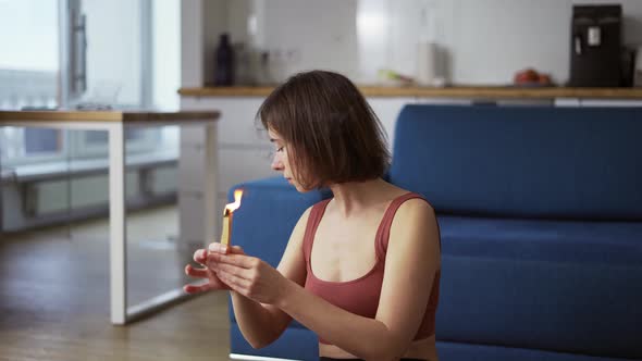 Woman Lighting a Fire Incense Herbs and Incense Waving It