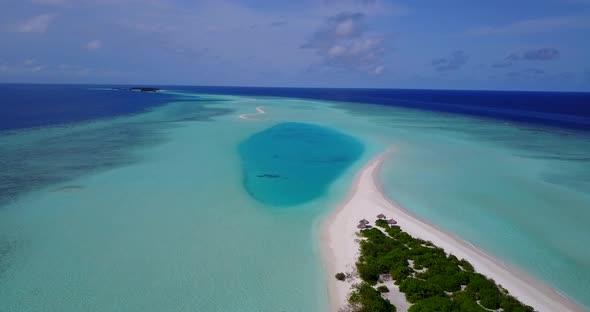 Tropical flying abstract shot of a summer white paradise sand beach and blue water background