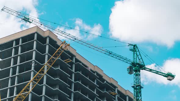 Time Lapse of Working Construction Crane Building. Beautiful Clouds Move Quickly Against Background