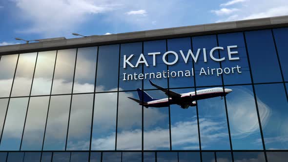 Airplane landing at Katowice Poland airport mirrored in terminal alt