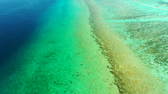 Aerial top view panorama of tropical resort beach trip by blue lagoon and white sand background of a