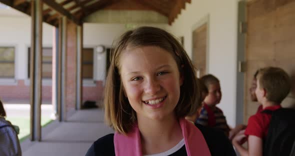 Girl smiling in the school corridor