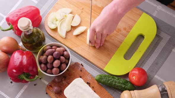 Greek Salad Preparation Series Concept  Woman Cutting Onions