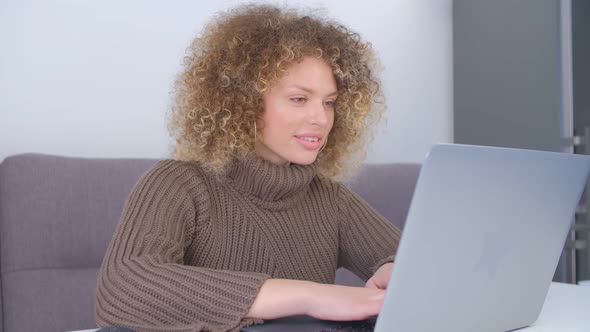 Cheerful whilte woman working freelance from home on lockdown in 4k stock video