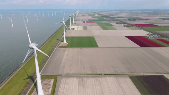 Offshore Windmill Park with Clouds and a Blue Sky Windmill Park in the Ocean Drone Aerial View with