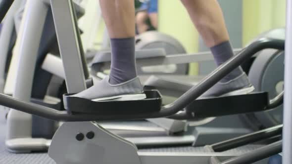 Close Up Footage of a Male Feet in a Cardio Workout at Gym.