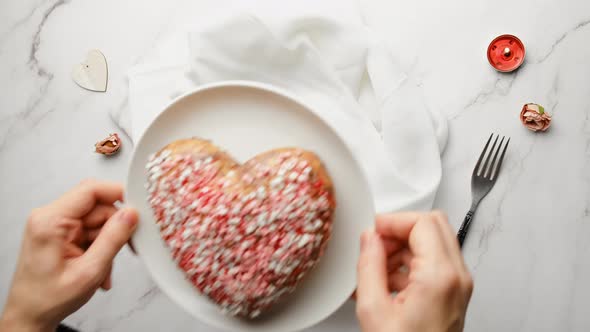 Woman Puts Sweet Food on the Table for Valentine's Day