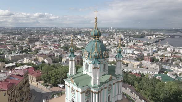 The Architecture of Kyiv. Ukraine. St. Andrew's Church. Aerial. Slow Motion, Gray, Flat
