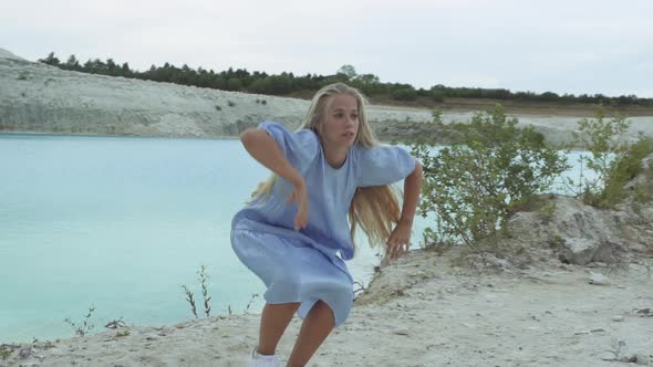 Woman In Blue Dancing In Quarry