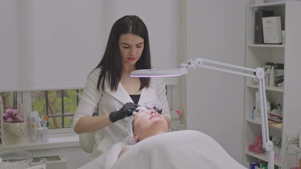 A Professional Cosmetologist Receives a Patient in His Office