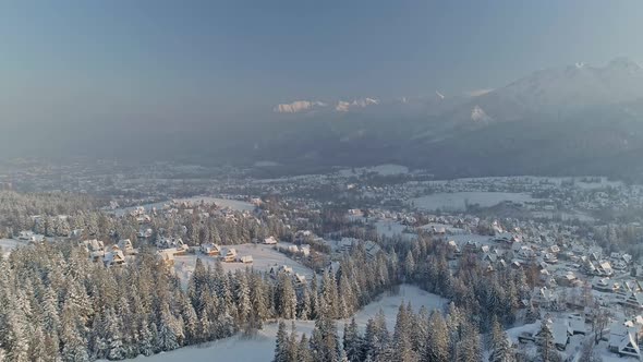 Panorama Of The Forest And Town Of Zakopane Capped With Snow In Poland. aerial