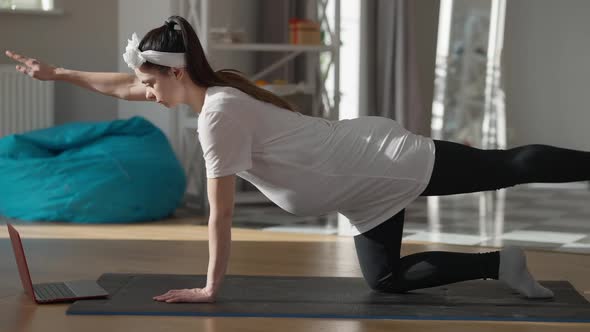 Home Workout of Pregnant Young Sportswoman Standing on All Fours on Exercise Mat