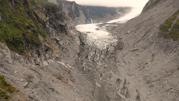 Aerial view of scenic Fox Glacier at the mountain range, New Zealand.