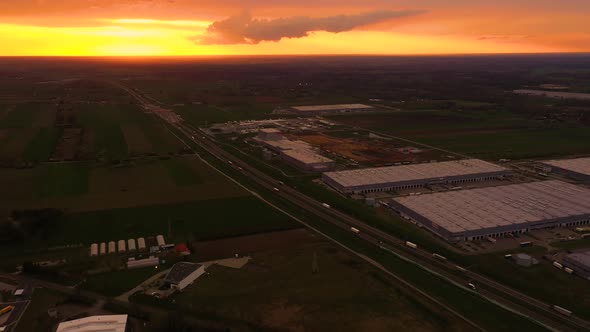 Semi-trailers trucks are waiting for the loading and unloading of goods at the warehouse ramps in a