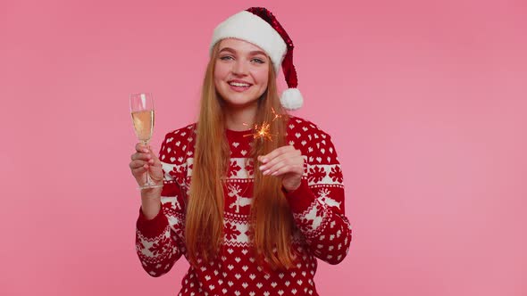 Girl in Christmas Sweater Dancing with Bengal Sparklers Fireworks and Champagne Send Congratulation