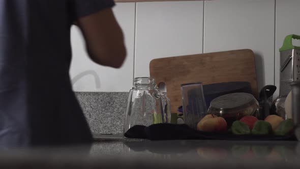 Cropped Image Of A Person Drying Glassware With Towel In The Kitchen - Static, Medium Shot