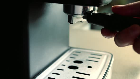 Barista Inserts Tray Ground Coffee Into Coffee Machine