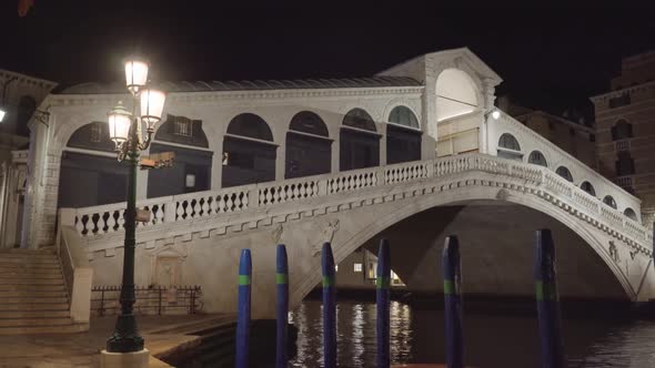 Illuminated Arch Rialto Bridge Over Grand Canal at Night