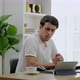 young man in casual clothes is stressed out of working from home on a desk with a computer and table - VideoHive Item for Sale