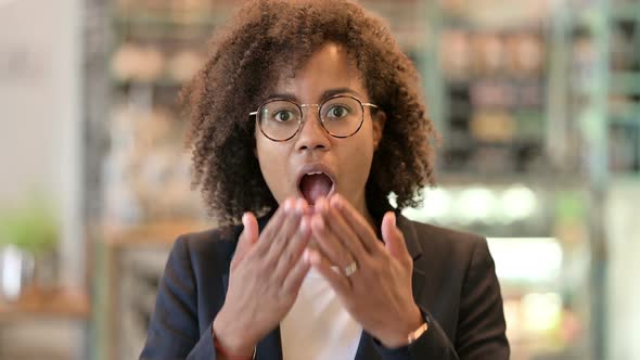 Excited African Businesswoman Celebrating Success