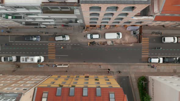 Aerial Birds Eye Overhead Top Down Tracking View of People Riding Bikes on Cycle Route in