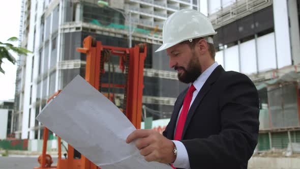 An Engineer a Developer at a Construction Site Checks the Drawings at What Stage of the Construction