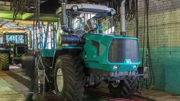 Conveyor Assembly Stage the Body of Tractor at Big Industrial Factory Timelapse