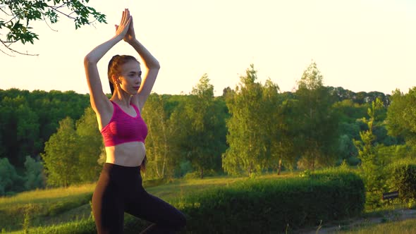 Woman Is Standing in a Heron Pose and Looking Forward While Meditation.