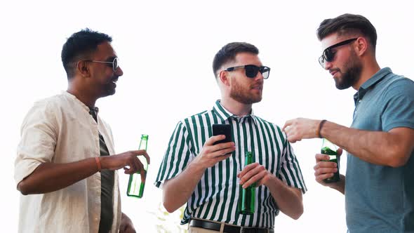 Men with Smartphone Drinking Beer on Rooftop
