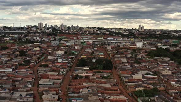 The Sol Nascente favela below and the modern city skyline in the distance - aerial view