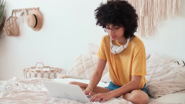 Afro American Woman Freelancer Typing on Laptop at Home