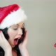 Happy young woman in santa hat with christmas gift - VideoHive Item for Sale