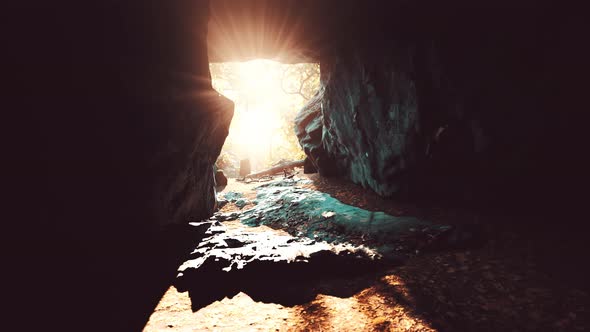 Breathtaking Scenery of Bright Sun Rays Falling Inside a Cave Illuminating